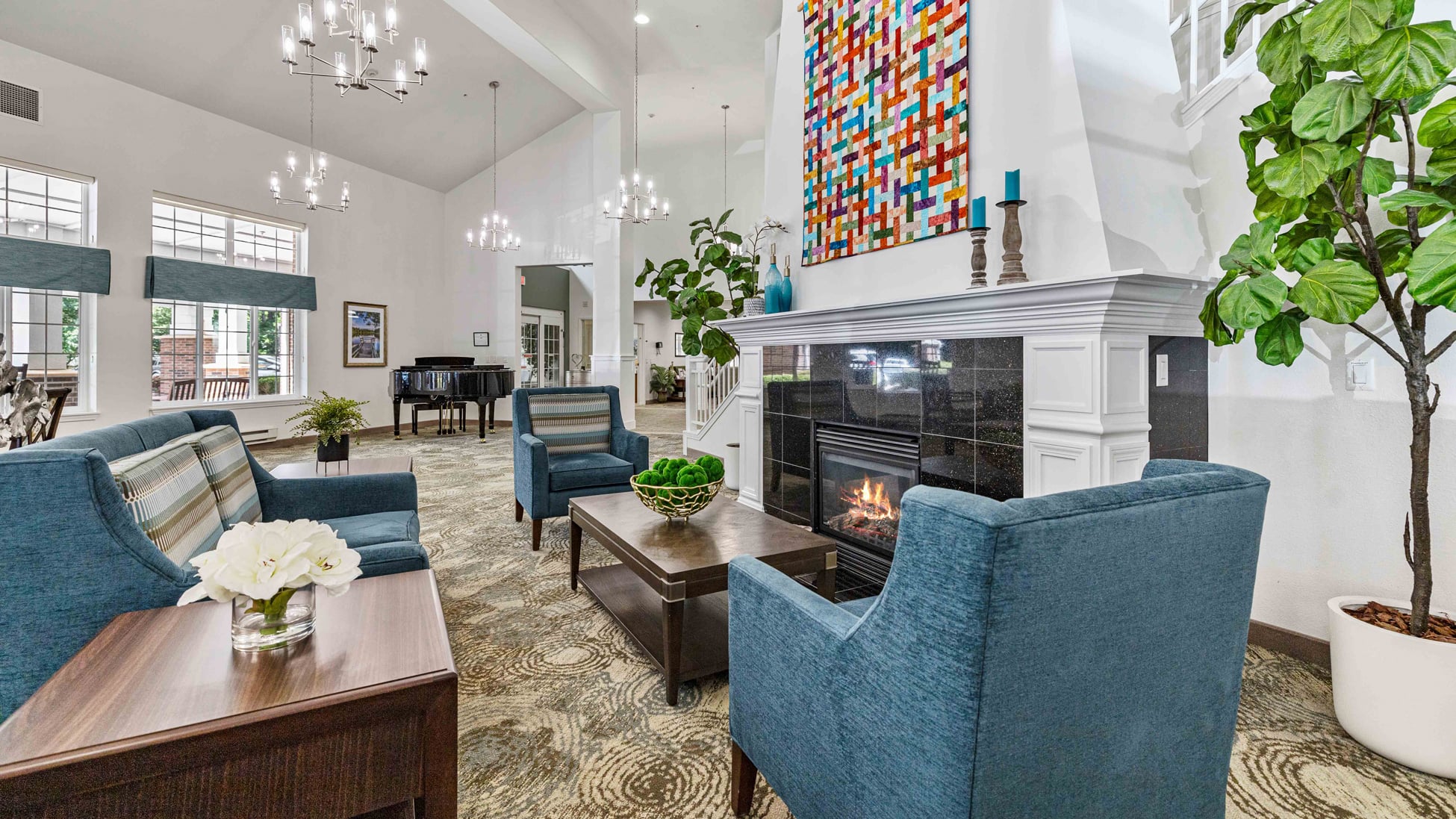 A cozy fireplace lounge at Whispering Pines